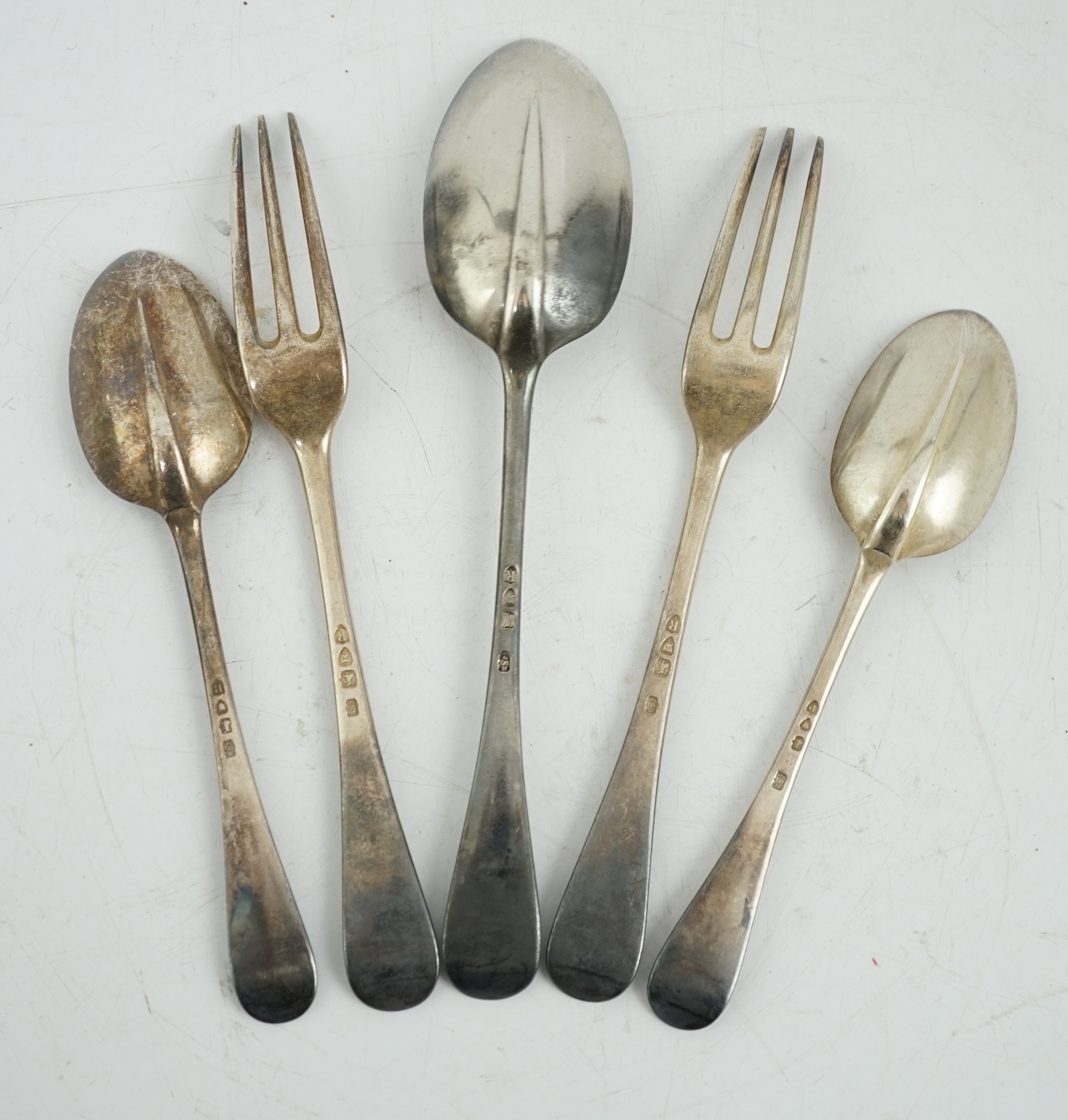 Sundry silver, consisting of three pieces of George III flatware, two 800 standard coffee spoons, a pair of candlesticks(a.f.), a lidded glass preserve pot, clothes brush, two pepperettes and a desk seal.